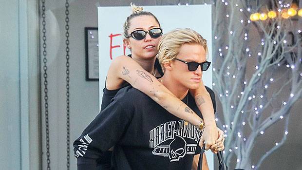 Miley Cyrus Cody Simpson Twin In All Black As He Gives Her A Piggyback Ride On Lunch Date - hollywoodlife.com