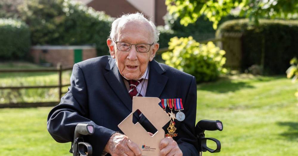 Captain Tom Moore, 99, breaks world record as he becomes oldest person to top music charts with NHS single - www.ok.co.uk - Choir