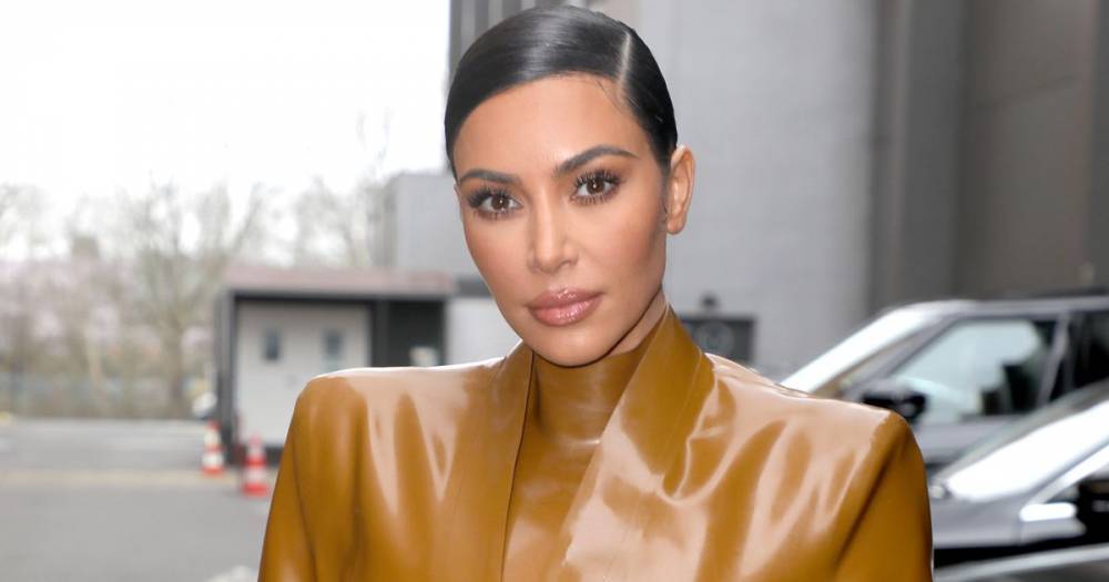 Kim Kardashian sets pulses racing as she poses topless with nothing but a bird on her shoulder - www.ok.co.uk