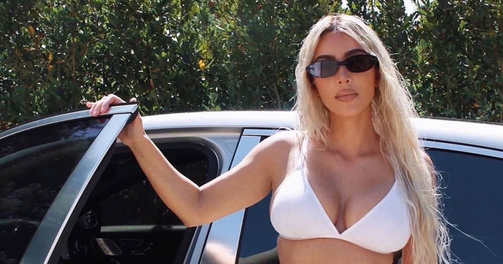 Kim Kardashian Is ‘All Dressed Up With Nowhere to Go’ in Assless Chaps and White Lingerie - www.usmagazine.com