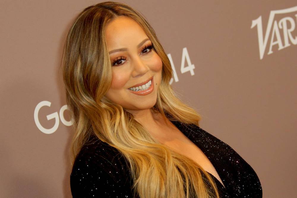 Mariah Carey surprises Schitt’s Creek cast during Hero performance - www.hollywood.com
