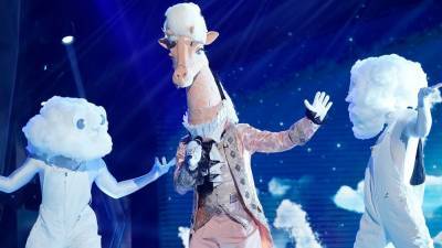 'The Masked Singer': The Giraffe Loses His Head in Unexpected Elimination -- See What Star Was Under the Mask - www.etonline.com