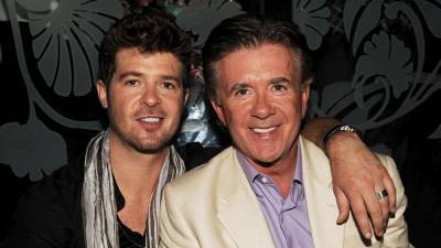 Robin Thicke Pays Tribute to Late Father Alan Thicke on the Anniversary of His Death - www.etonline.com