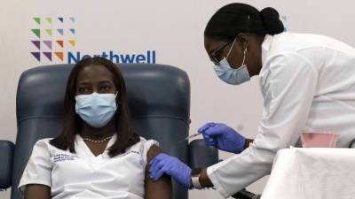 First COVID-19 Vaccine Is Given in New York - www.etonline.com - New York - New York - city Sandra