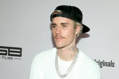 Justin Bieber ties Drake as most successful top five artist this century - www.hollywood.com