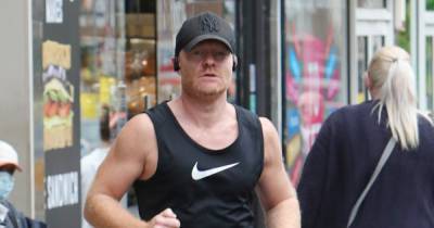 EastEnders star Jake Wood flashes impressive biceps as he goes out for a run after return to filming - www.ok.co.uk - London