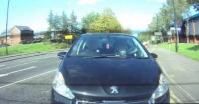 Driver seen inhaling suspected 'hippy crack' from a balloon while behind the wheel on a busy road - www.manchestereveningnews.co.uk - Manchester