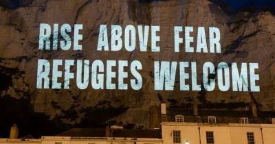 Message welcoming refugees beamed onto the White Cliffs of Dover ahead of protests - www.manchestereveningnews.co.uk - city Dover
