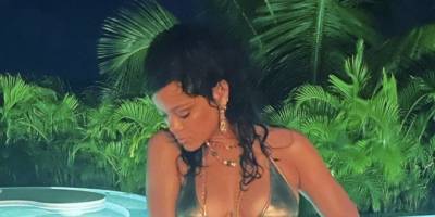 Rihanna Poses in a Metallic Bikini, a Gold Wrap Skirt, and Lace-Up Gladiator Heels - www.harpersbazaar.com