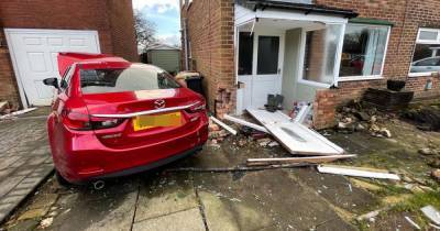 BREAKING: Man dies after car crashes into two houses in Bolton - www.manchestereveningnews.co.uk - Manchester