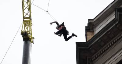 Stuntman leaps off city centre building roof as Disney film crews return to Manchester - www.manchestereveningnews.co.uk - Manchester