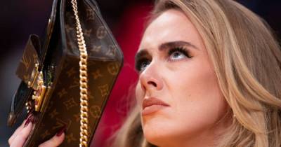 Adele hides behind Louis Vuitton bag as new single plays at basketball game - www.ok.co.uk - Los Angeles