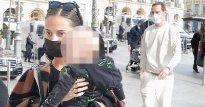Alicia Vikander cradles her baby while arriving at a hotel in Paris - www.msn.com - Paris