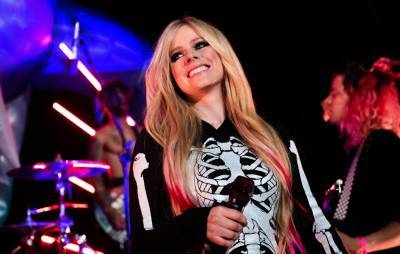 Avril Lavigne signs to Travis Barker’s record label and teases new single - www.nme.com