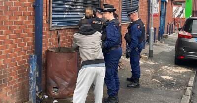 Christmas Eve on city's 'counterfeit street' as police crack down on violence - www.manchestereveningnews.co.uk - Manchester