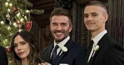 David Beckham fans in hysterics as he stands on his tip toes in Christmas snap - www.ok.co.uk
