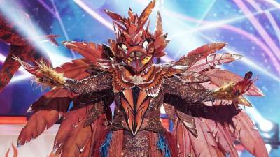 'The Masked Singer': The Phoenix Burns Out After Group B Premiere -- See Who Was Under the Feathery Mask! - www.etonline.com