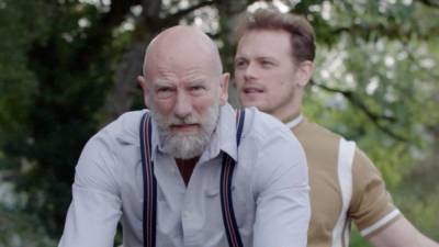 Watch Sam Heughan and Graham McTavish Ride a Tandem Bike on 'Men in Kilts' (Exclusive) - www.etonline.com - Scotland