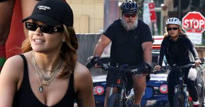 Rita Ora enjoys a bike ride through Sydney with Russell Crowe - www.msn.com - Britain