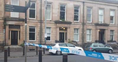Woman found dead in Glasgow flat as police cordon off scene - www.dailyrecord.co.uk - Scotland