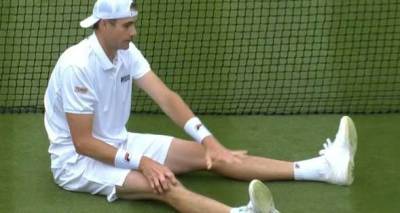 John Isner becomes latest victim on Wimbledon courts with nasty slip on tricky surface - www.msn.com