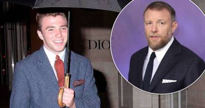 Rocco Ritchie channels his director dad Guy in a suave navy suit - www.msn.com - London - Michigan