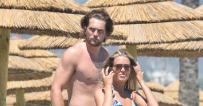 Lottie Tomlinson and Lewis Burton spotted packing on the PDA on a beach - www.ok.co.uk - Spain