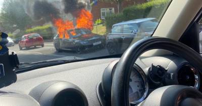 Police investigate 'arson attack' after BMW set alight and Mini found damaged - www.manchestereveningnews.co.uk - Manchester