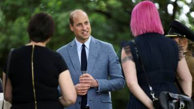 Prince William Hosts Royal Tea Party Solo as Wife Kate Middleton Self-Isolates Due to COVID Exposure - www.etonline.com