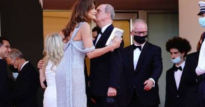 Cannes film president breaks Covid kissing rule on first red carpet - www.msn.com - France