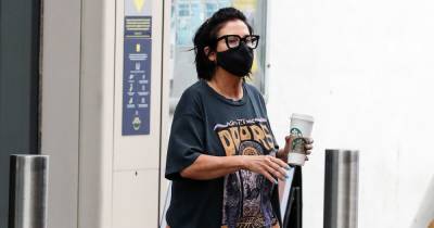 Jessie Wallace dresses down in Doors T-shirt and fluffy slippers to grab coffee - www.ok.co.uk - county Door