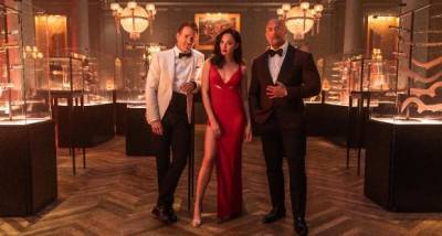 Red Notice: Dwayne Johnson, Ryan Reynolds & Gal Gadot ooze James Bond vibes in new still; REVEAL release date - www.pinkvilla.com