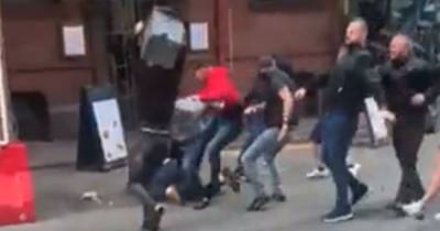 Shocking video shows violent scenes between Manchester United and Leeds fans in city centre - www.manchestereveningnews.co.uk - Manchester
