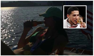 Kendall Jenner poses with Devin Booker’s Olympic gold medal and a bottle of beer while on a lake date - us.hola.com - USA - Tokyo