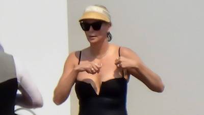 Charlize Theron Rocks Black Swimsuit While Paddle Boarding In Greece As She Celebrates 46th Birthday — Photos - hollywoodlife.com - Greece
