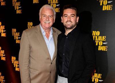 Marty Whelan and his lookalike son enjoy night out at Bond premiere - evoke.ie - London - county Hall