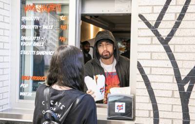 Eminem surprises fans at opening of Mom’s Spaghetti restaurant in Detroit - www.nme.com - Detroit