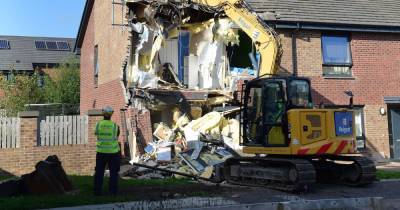 Demolition crew called to East Kilbride house at centre of lorry smash probe as digger pulls down wrecked wall - www.dailyrecord.co.uk - Scotland
