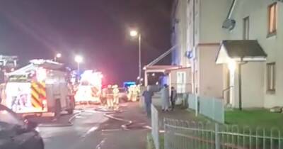 Woman rushed to hospital after ‘deliberate’ blaze at Scots flats as cops hunt firebugs - www.dailyrecord.co.uk - Scotland