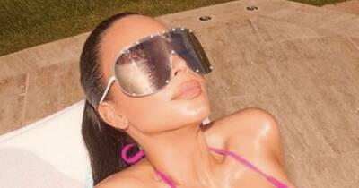 Kim Kardashian wows in tiny pink bikini during sun-soaked holiday - www.ok.co.uk - USA