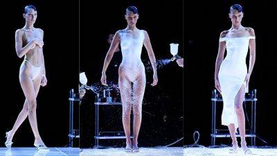 Bella Hadid struts runway topless, then gets white dress spray-painted for Paris Fashion Week - www.foxnews.com - Paris - Italy