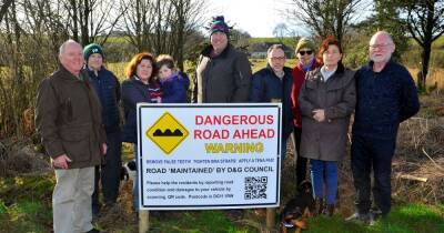 Dumfries and Galloway residents create own pothole warning sign in bid to get "reaction" from council - www.dailyrecord.co.uk - county Woods - county Bryan - city Springfield