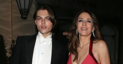 Liz Hurley wows in plunging gown as lookalike son Damian escorts her to Joan Collins' party - www.ok.co.uk - London