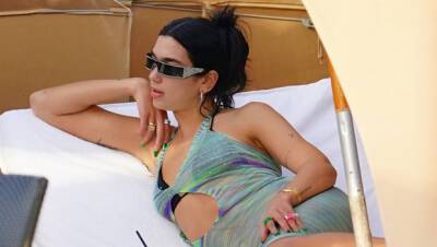 Dua Lipa Wears Sheer Dress As She Lounges At Beach 6 Weeks After Anwar Hadid Split – Photos - hollywoodlife.com - Britain - Los Angeles - Miami