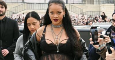 Pregnant Rihanna flaunts baby bump in sheer négligée and knee-high boots at PFW - www.ok.co.uk - New York - city Harlem, state New York