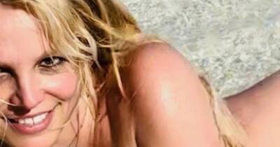 Britney puts on steamy display as she poses naked on beach in new pictures - www.ok.co.uk - Brazil