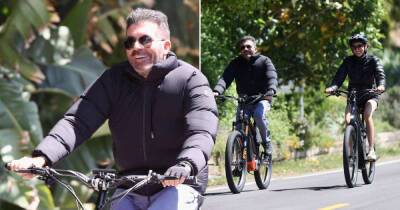 Simon Cowell all smiles on bike ride with fiancée after removing fillers from face - www.msn.com - Britain - Miami - California