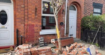 Woman devastated after two cars smash into the front of her house - www.manchestereveningnews.co.uk - county Lane