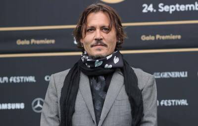 Johnny Depp focusing on a “doodle” in court goes viral - www.nme.com - Washington
