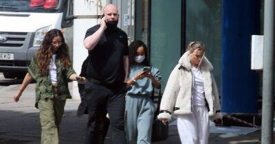 Little Mix girls dwarfed by burly bodyguard as they attempt to go unnoticed on day out - www.ok.co.uk - Britain - London - USA